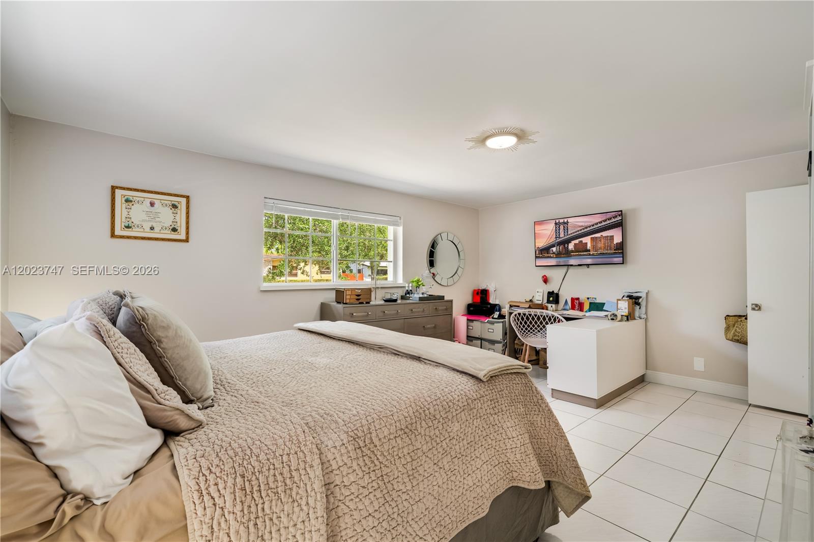 11515 Southwest 81st Road, Unit 11515 Pinecrest, FL 33156 - Photo 27 of 33 a bed room with a bed and white walls