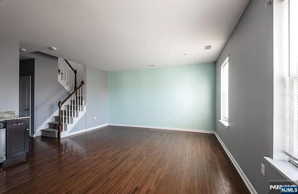 7 Myrtle Street, Unit 10 Bloomfield, NJ 07003 - Photo 5 of 13 wooden floor in an empty room with a window