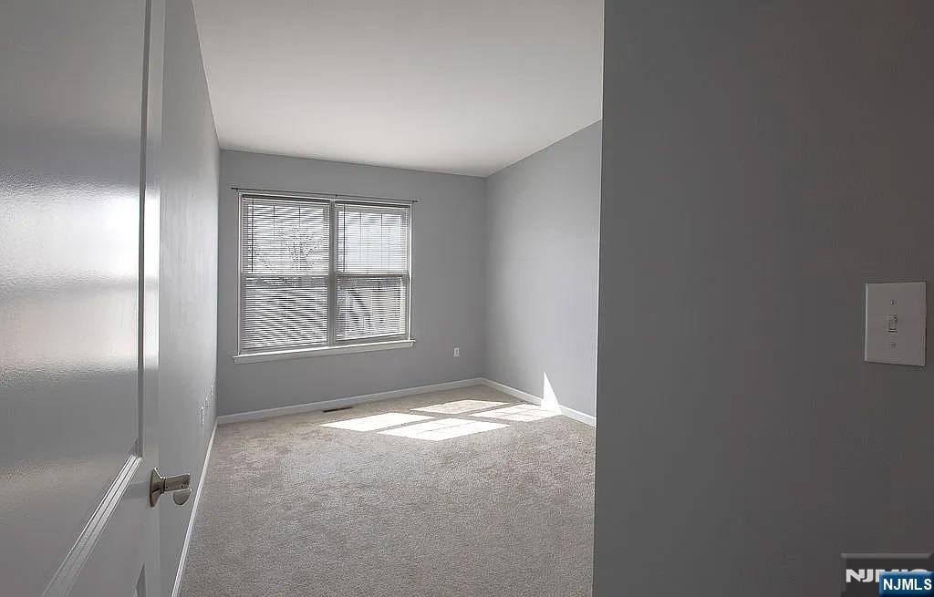 7 Myrtle Street, Unit 10 Bloomfield, NJ 07003 - Photo 6 of 13 a view of an empty room and window
