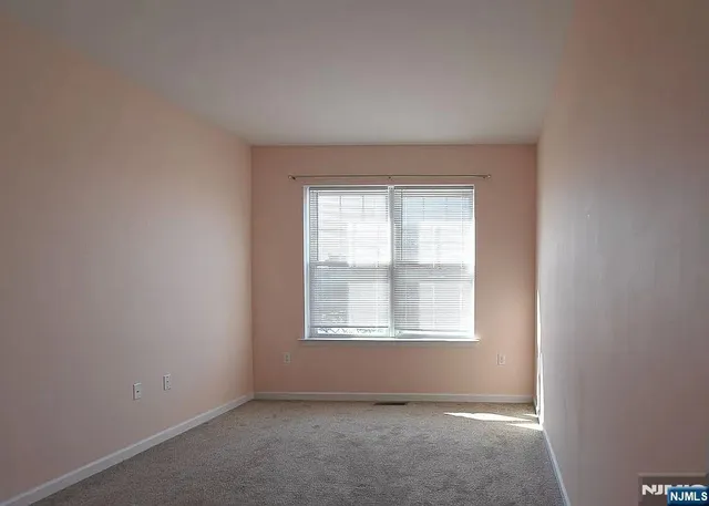 an empty room with closet area