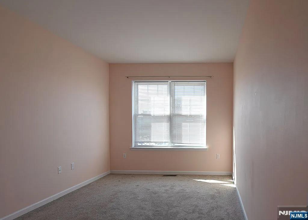 7 Myrtle Street, Unit 10 Bloomfield, NJ 07003 - Photo 10 of 13 an empty room with a window