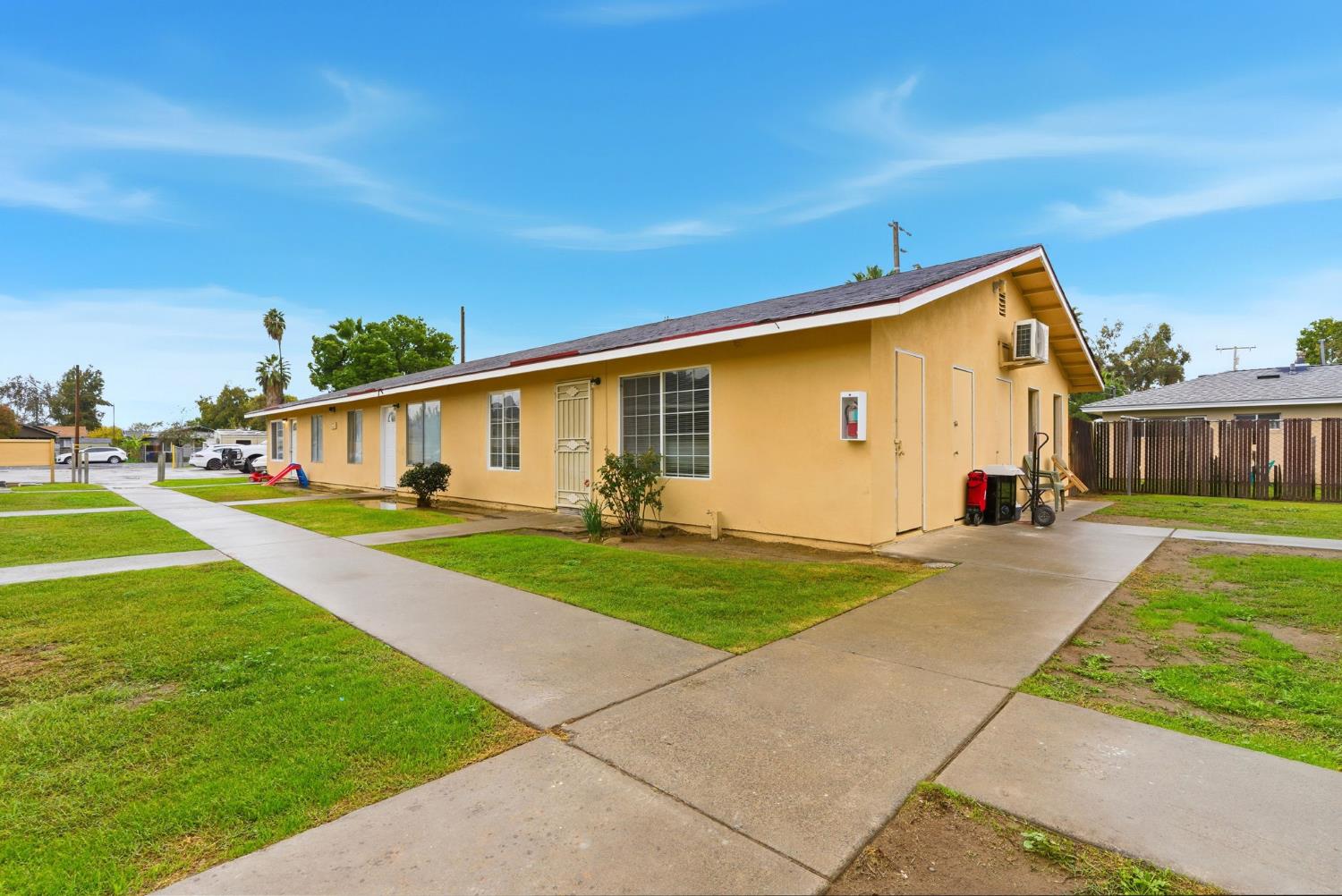 616 South Irwin Street, Unit C Hanford, CA 93230 - Photo 5 of 26 a front view of a house with garden