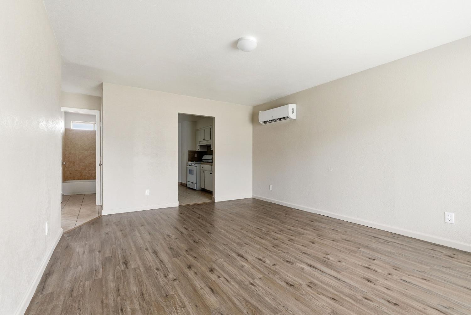 616 South Irwin Street, Unit C Hanford, CA 93230 - Photo 7 of 26 a view of an empty room with closet and a window