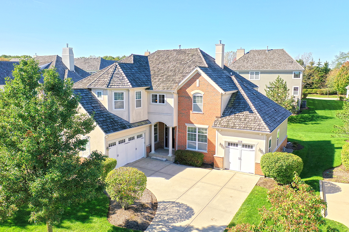 a view of multiple houses with yard