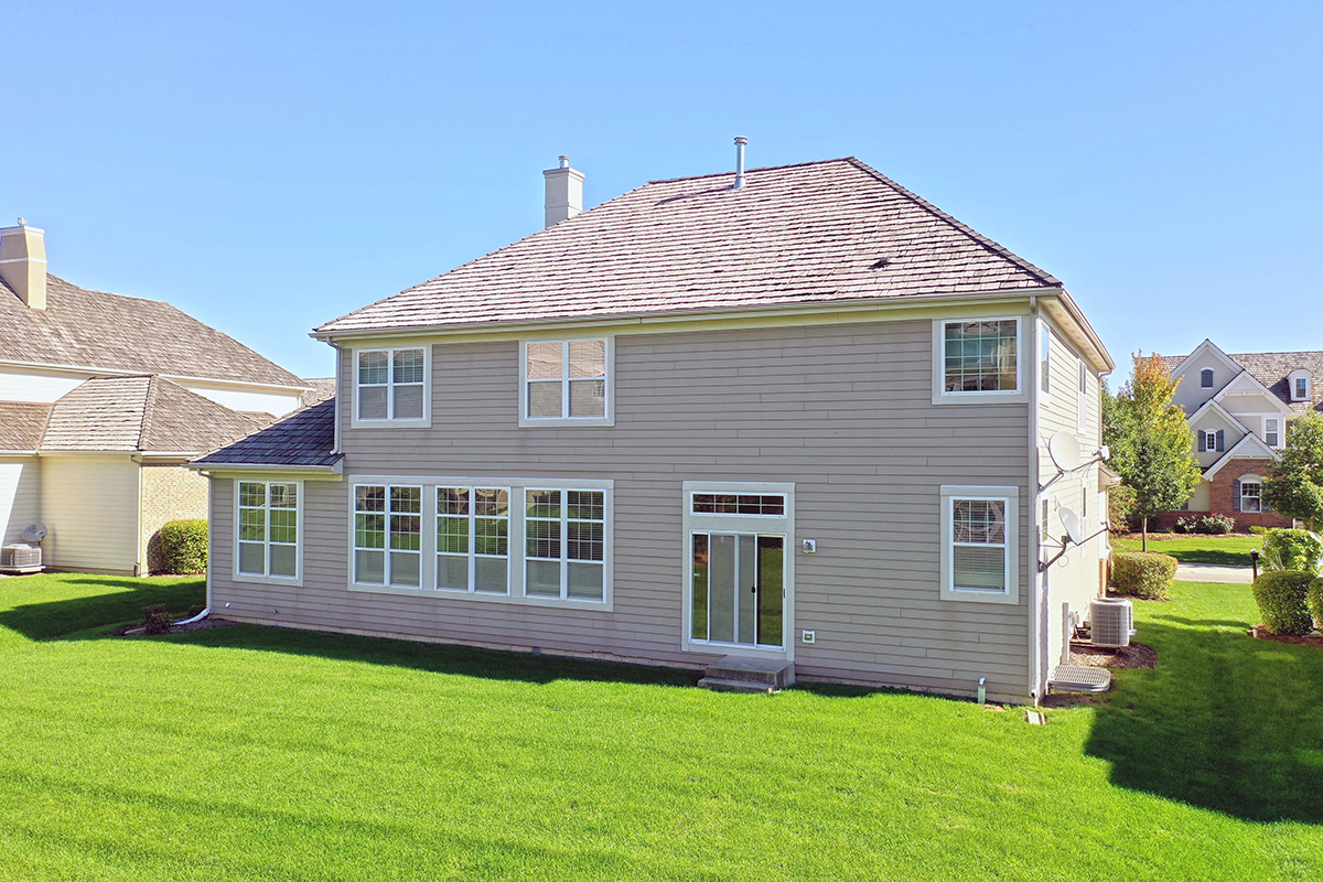 1118 Ashley Lane Inverness, IL 60010 - Photo 11 of 50 a front view of a house with a yard