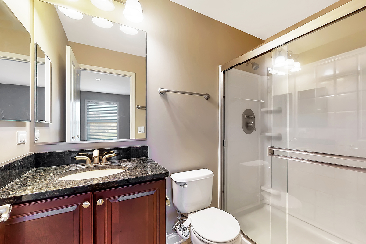 1118 Ashley Lane Inverness, IL 60010 - Photo 37 of 50 a bathroom with a granite countertop sink toilet and shower