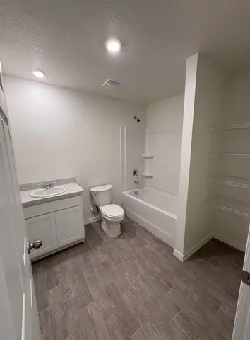 a view of an empty room and a window