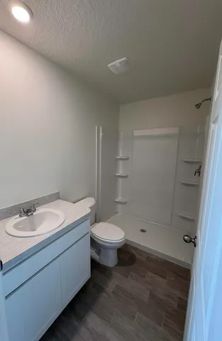 a view of a storage & utility room with a washer dryer