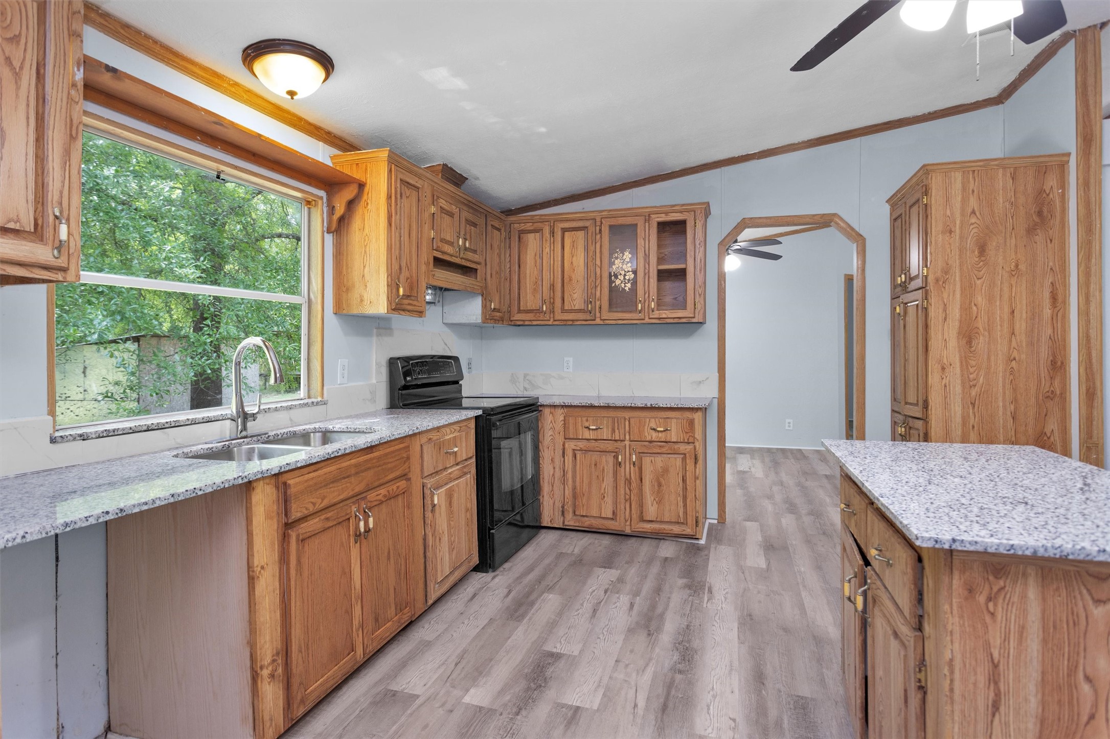 1001 County Line Road Shepherd, TX 77371 - Photo 23 of 46 a kitchen with stainless steel appliances granite countertop a sink stove and refrigerator