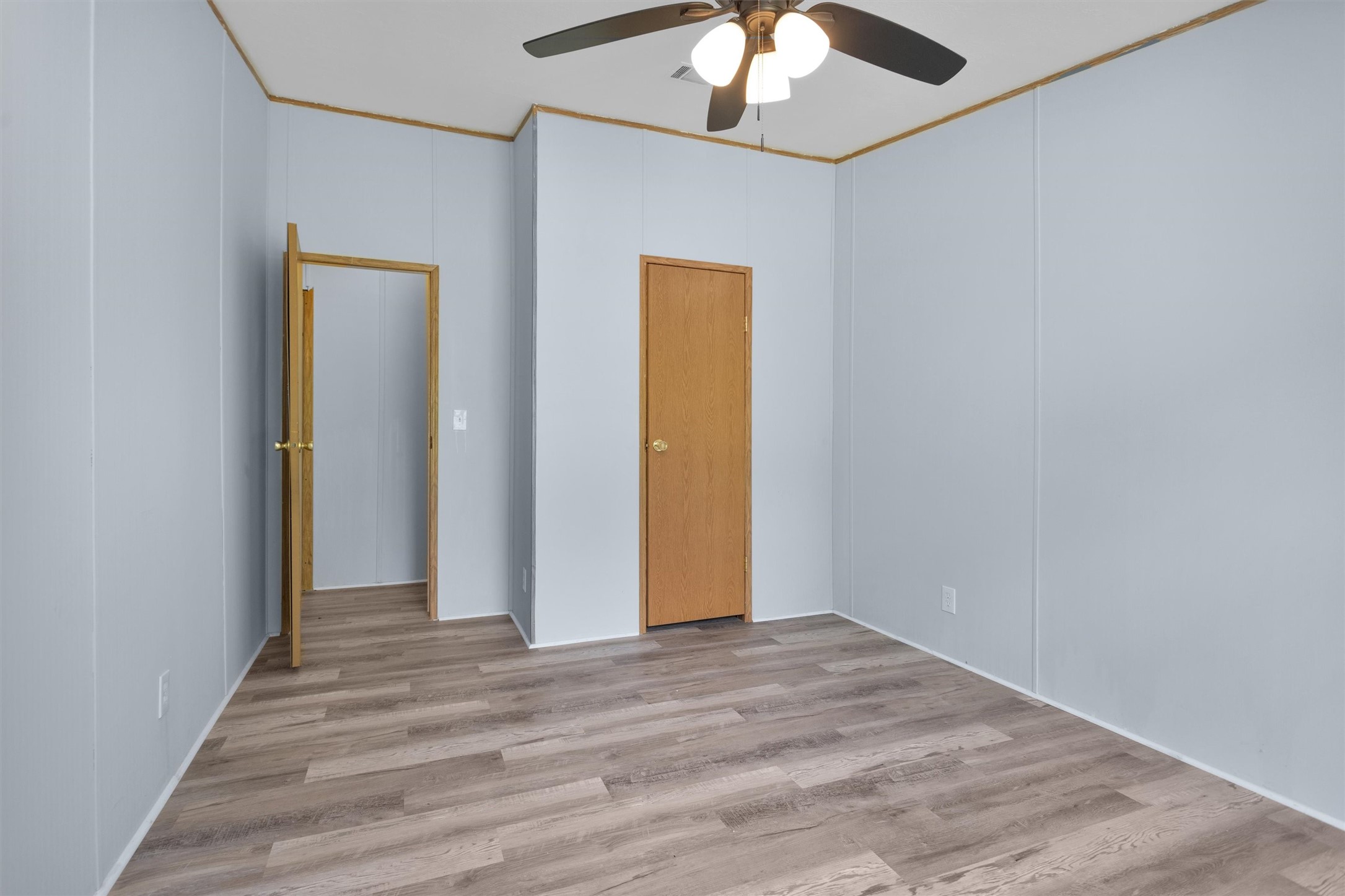 1001 County Line Road Shepherd, TX 77371 - Photo 27 of 46 wooden floor in an empty room with a window