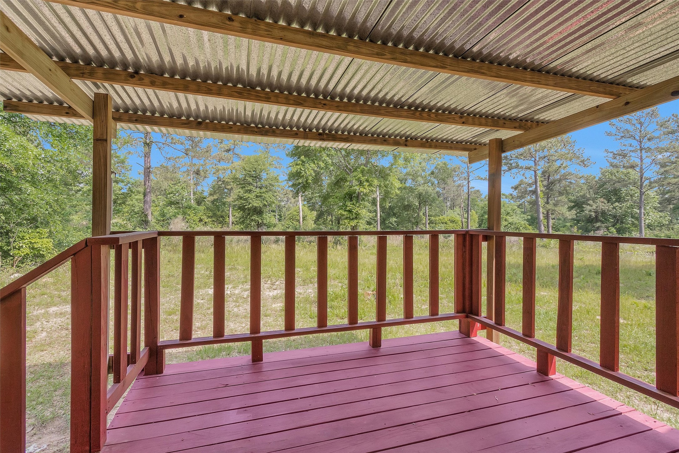 1001 County Line Road Shepherd, TX 77371 - Photo 36 of 46 a view of outdoor space with wooden floor barbeque and outdoor seating