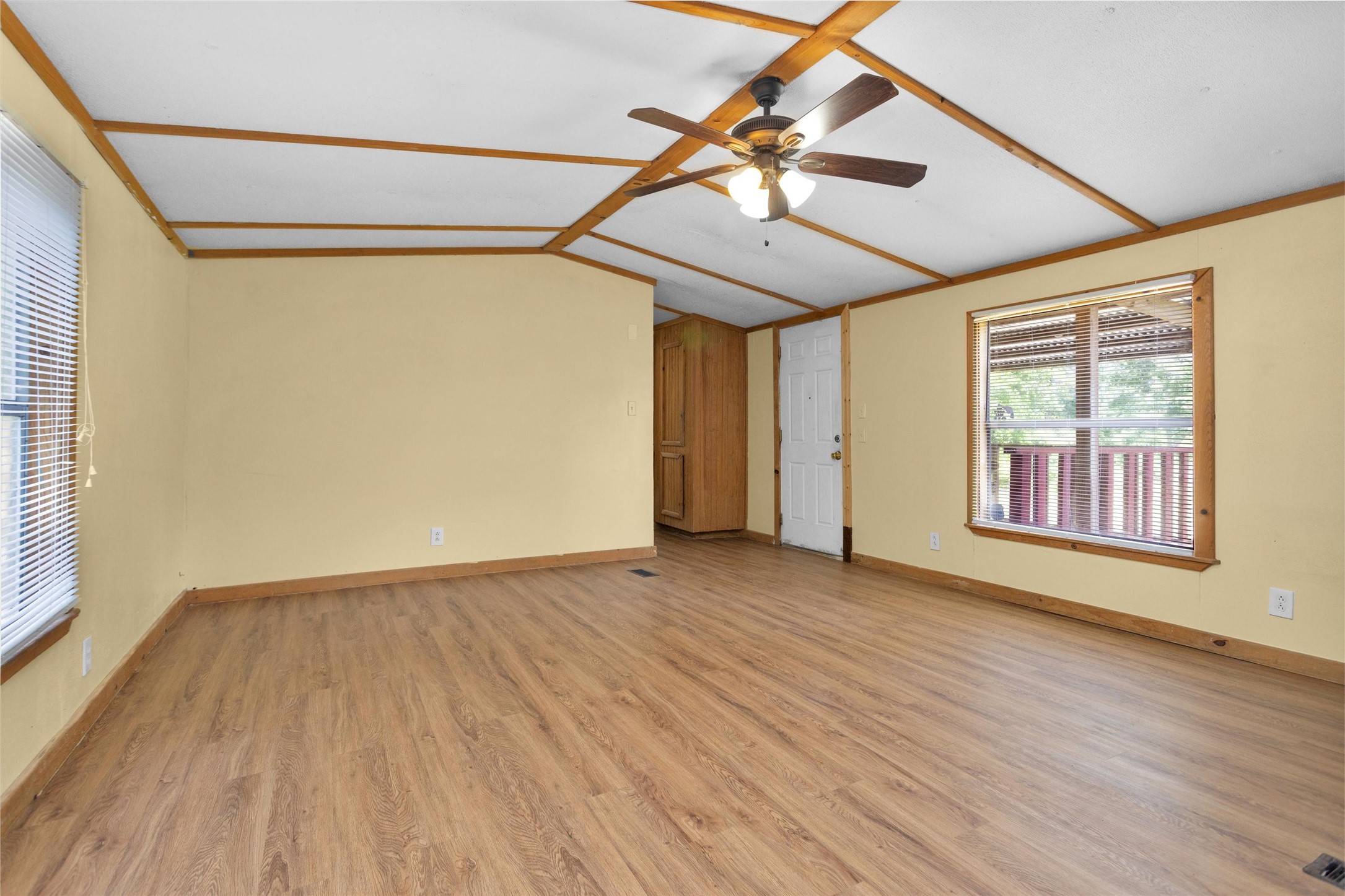 1001 County Line Road Shepherd, TX 77371 - Photo 38 of 46 an empty room with wooden floor fan and windows