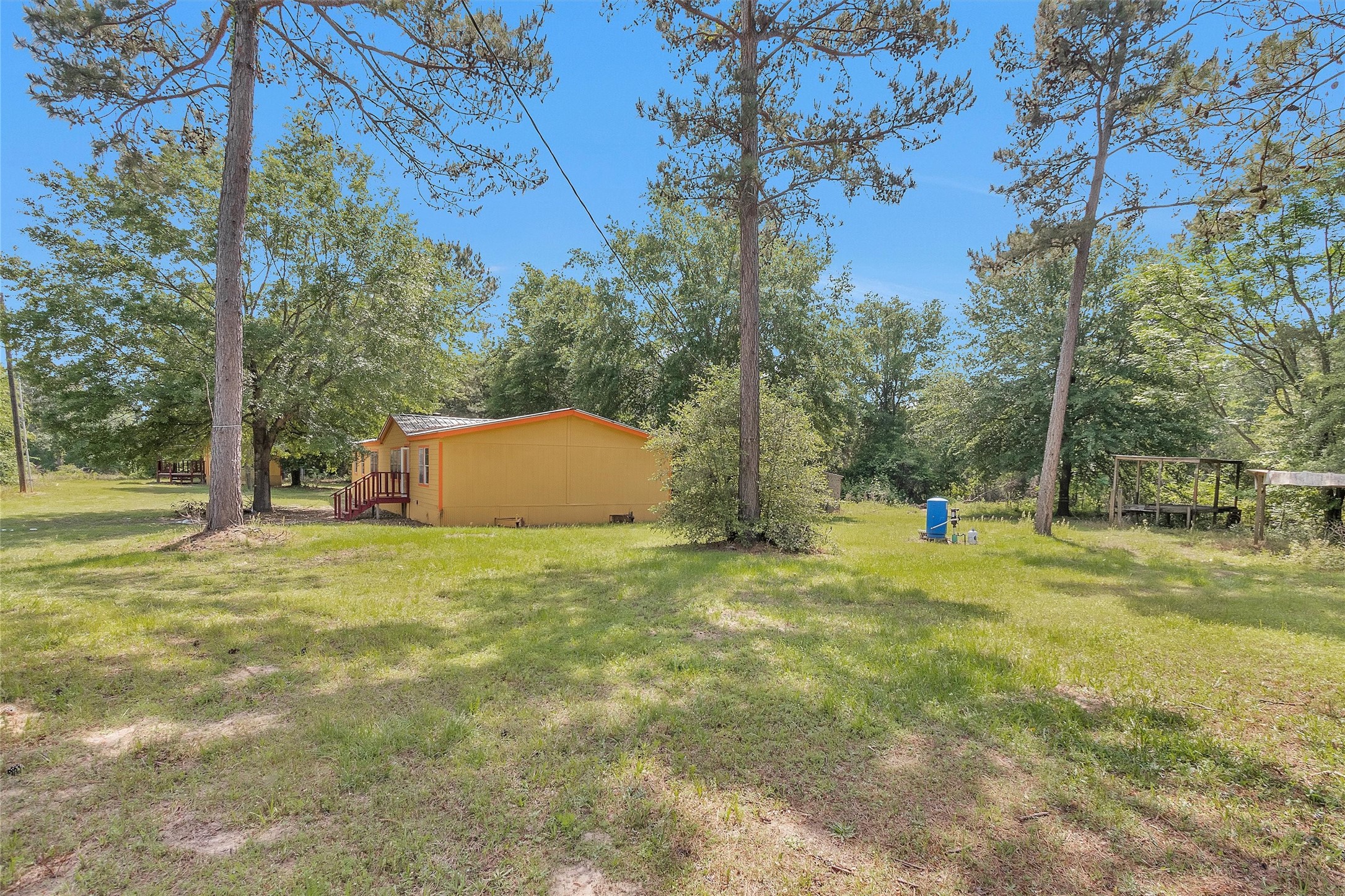 1001 County Line Road Shepherd, TX 77371 - Photo 6 of 46 a backyard of a house
