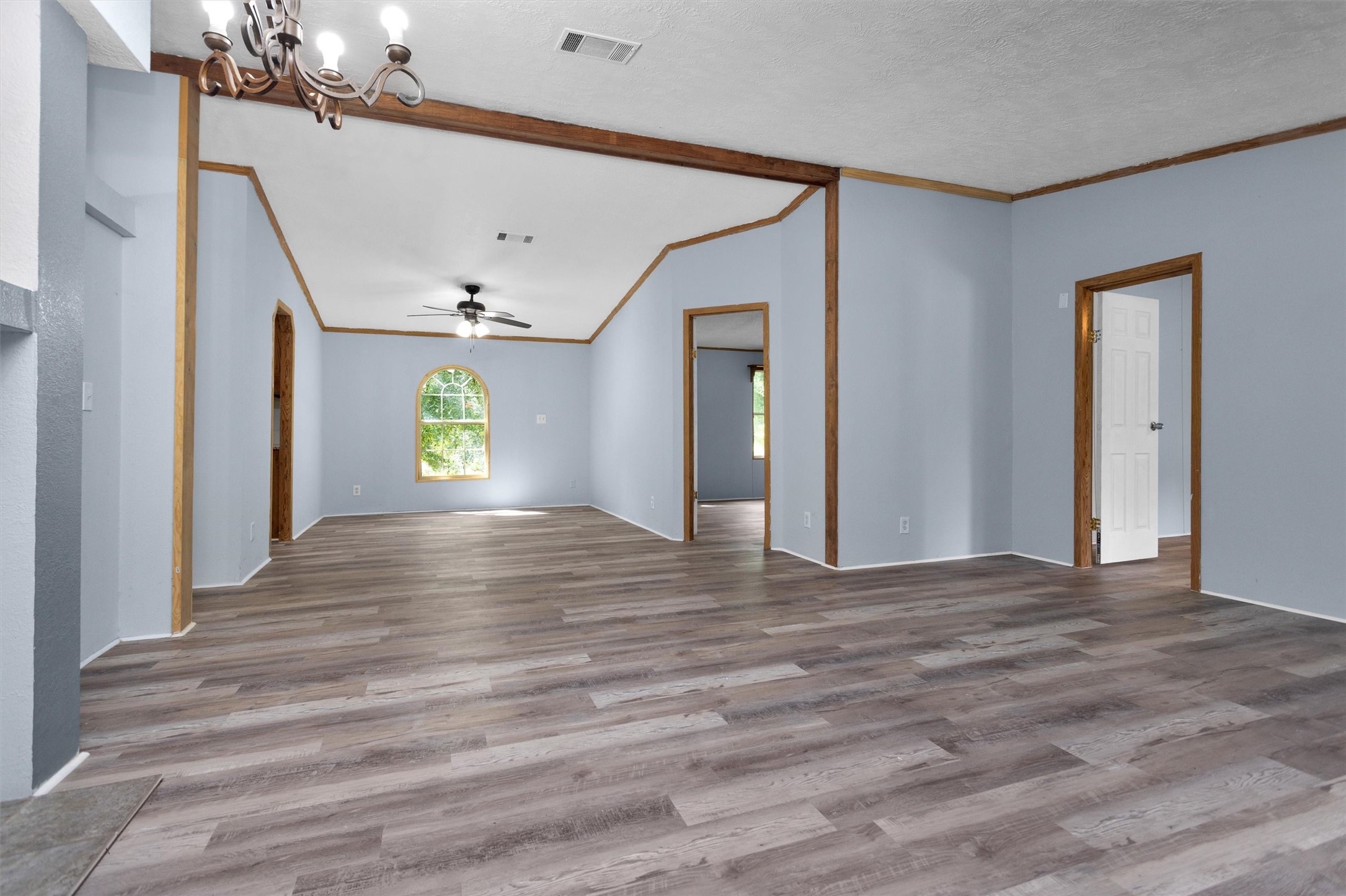 1001 County Line Road Shepherd, TX 77371 - Photo 8 of 46 a view of an empty room with window and wooden floor