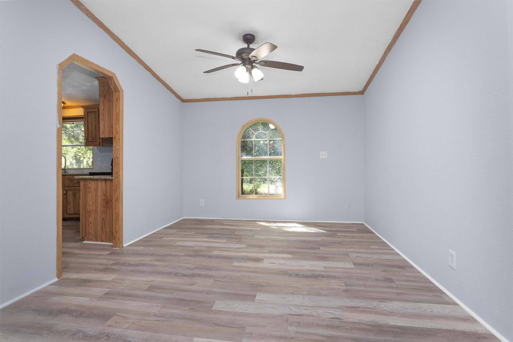 1001 County Line Road Shepherd, TX 77371 - Photo 9 of 46 wooden floor in an empty room with a window
