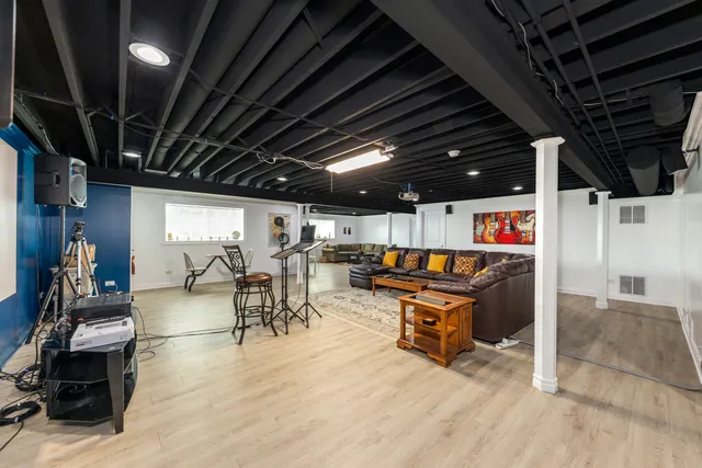 a view of a studio with wooden floor