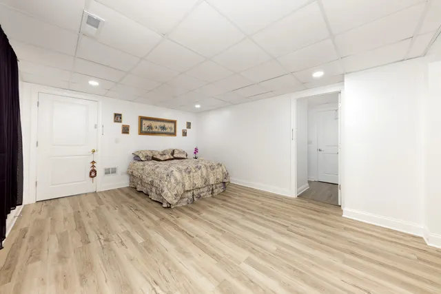 a bedroom with a bed and a table