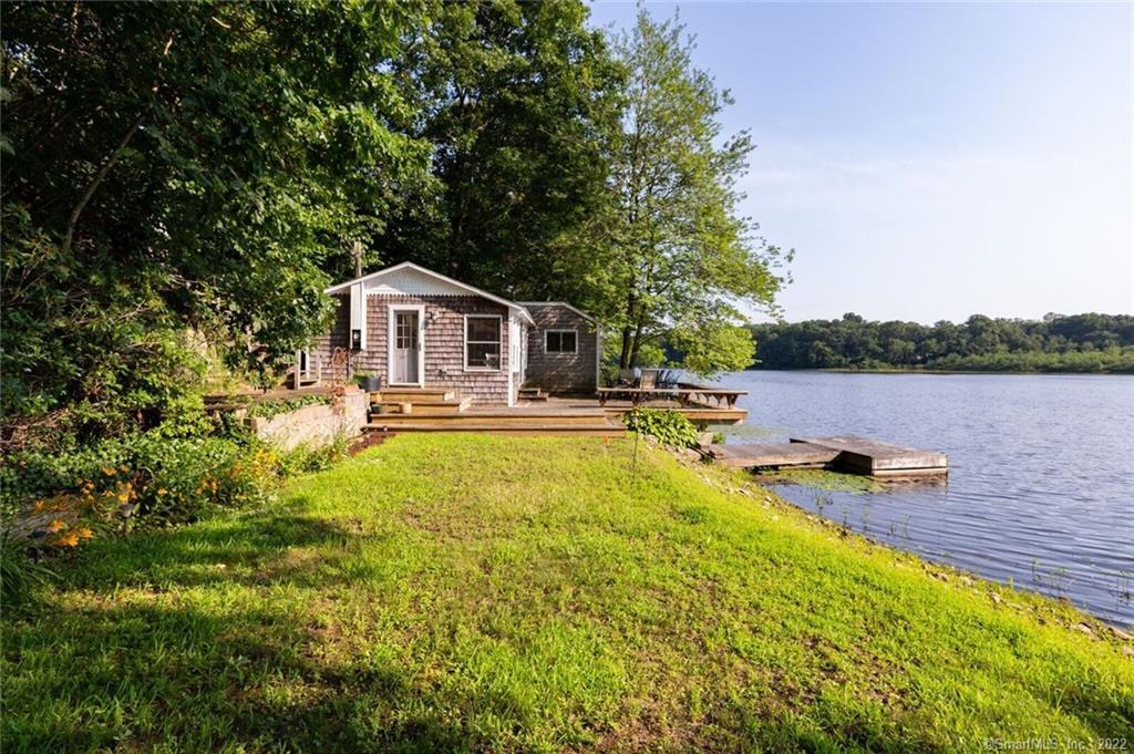 12 Sunset Circle Guilford, CT 06437 - Photo 1 of 1 WELCOME TO THE LAKE... 12 Sunset Circle sits directly on West Lake providing fabulous year round water-views.