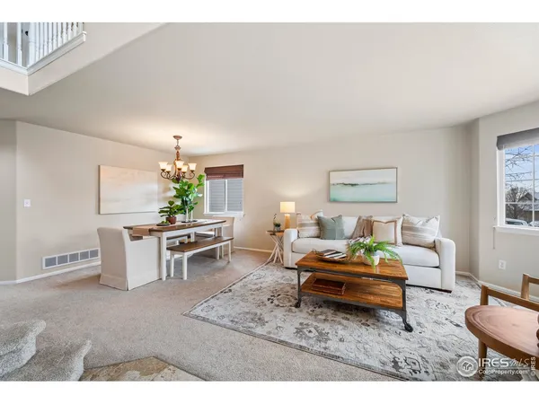 a living room with furniture and a table