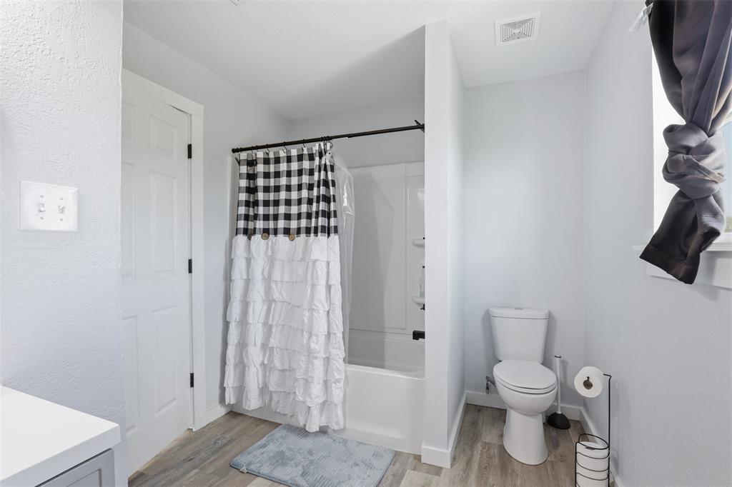 1865 Old Denton Highway Decatur, TX 76234 - Photo 22 of 37 a bathroom with a toilet and a shower