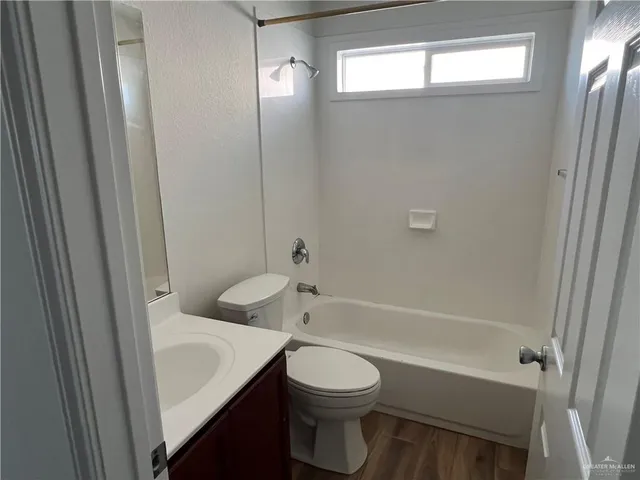 a bathroom with a toilet a sink and bathtub