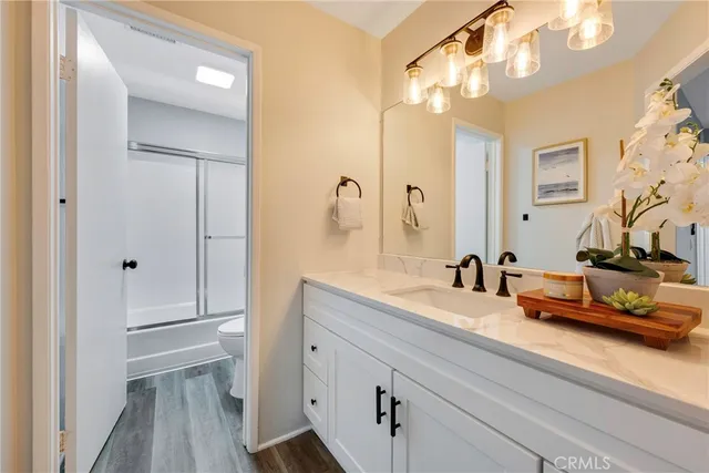 a bathroom with a sink a vanity and a mirror