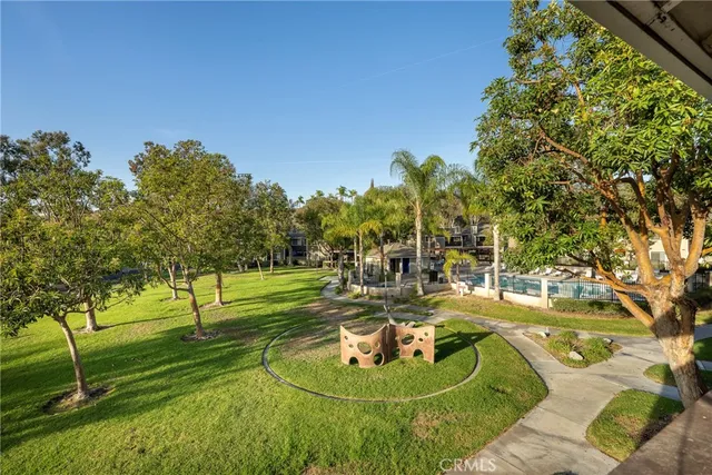 a backyard of a house with a yard and outdoor seating