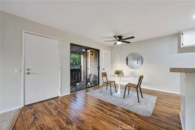 a view of a livingroom with furniture and wooden floor