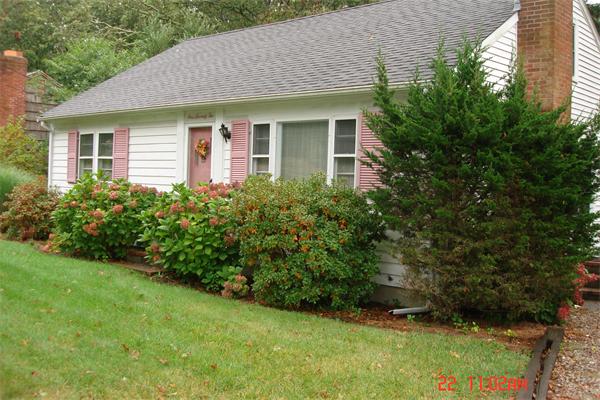 172 Telegraph Road Dennis, MA 02639 - Photo 1 of 9 a view of a house with a yard