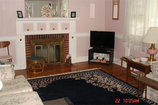 172 Telegraph Road Dennis, MA 02639 - Photo 3 of 9 a living room with furniture and a fireplace