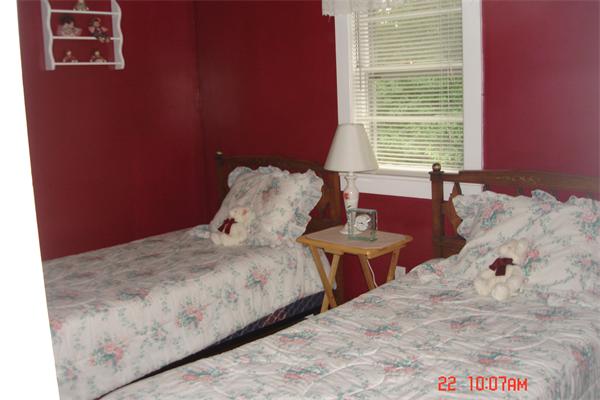 172 Telegraph Road Dennis, MA 02639 - Photo 7 of 9 a bed sitting in a bedroom next to a window
