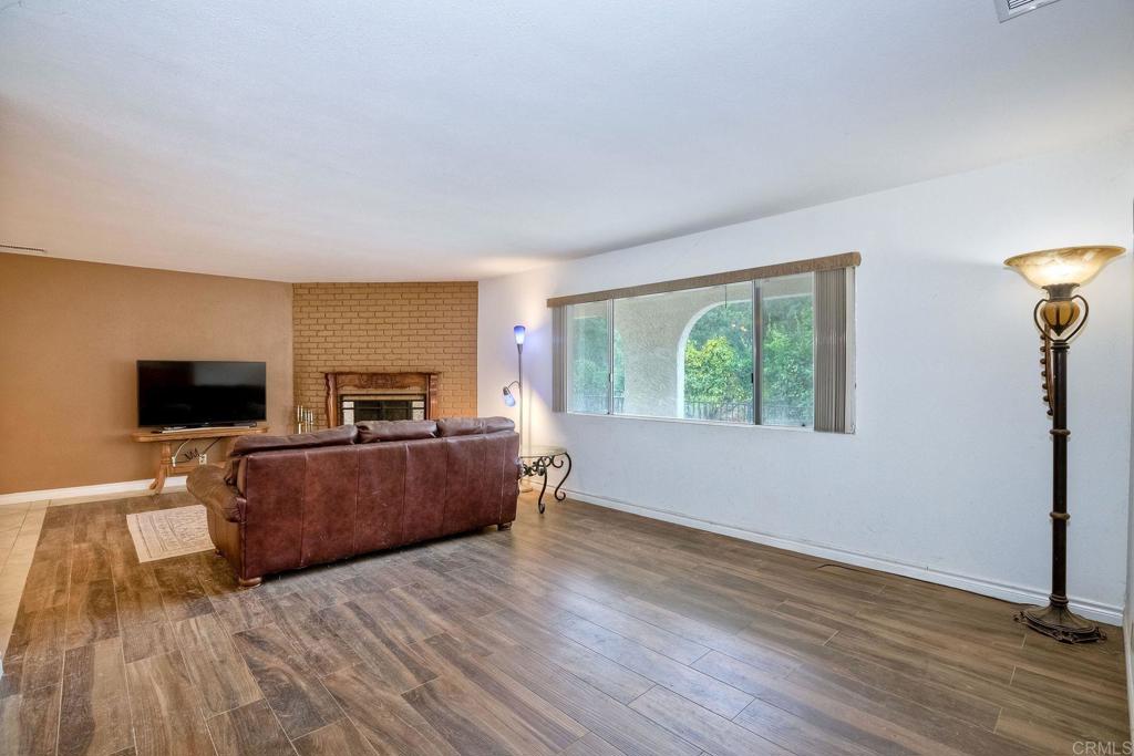 548 Taylor Street Vista, CA 92084 - Photo 12 of 74 a living room with furniture and a flat screen tv