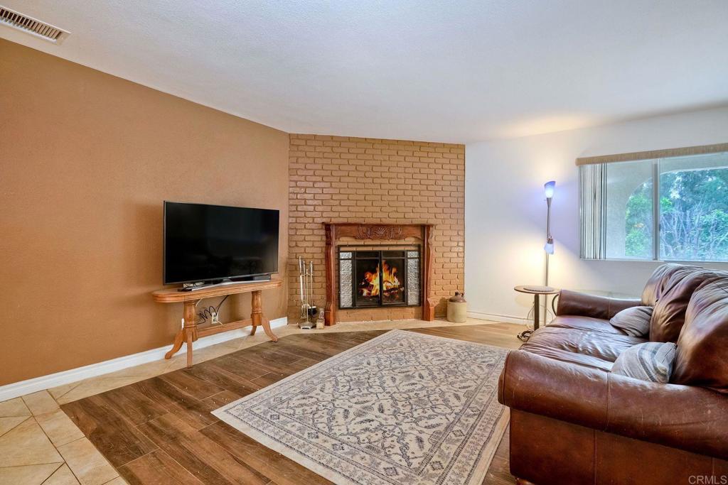 548 Taylor Street Vista, CA 92084 - Photo 13 of 74 a living room with furniture and a flat screen tv