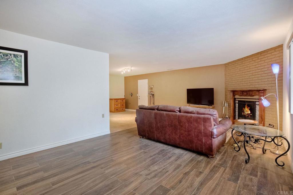 548 Taylor Street Vista, CA 92084 - Photo 14 of 74 a living room with furniture and a flat screen tv