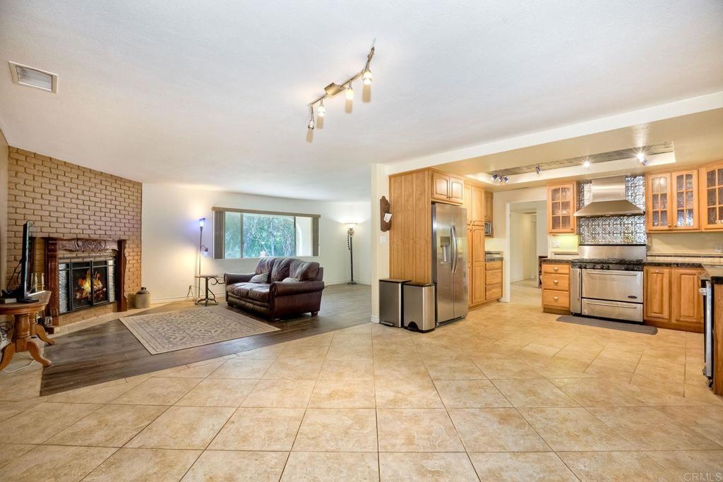 548 Taylor Street Vista, CA 92084 - Photo 18 of 74 a living room with furniture and a fireplace