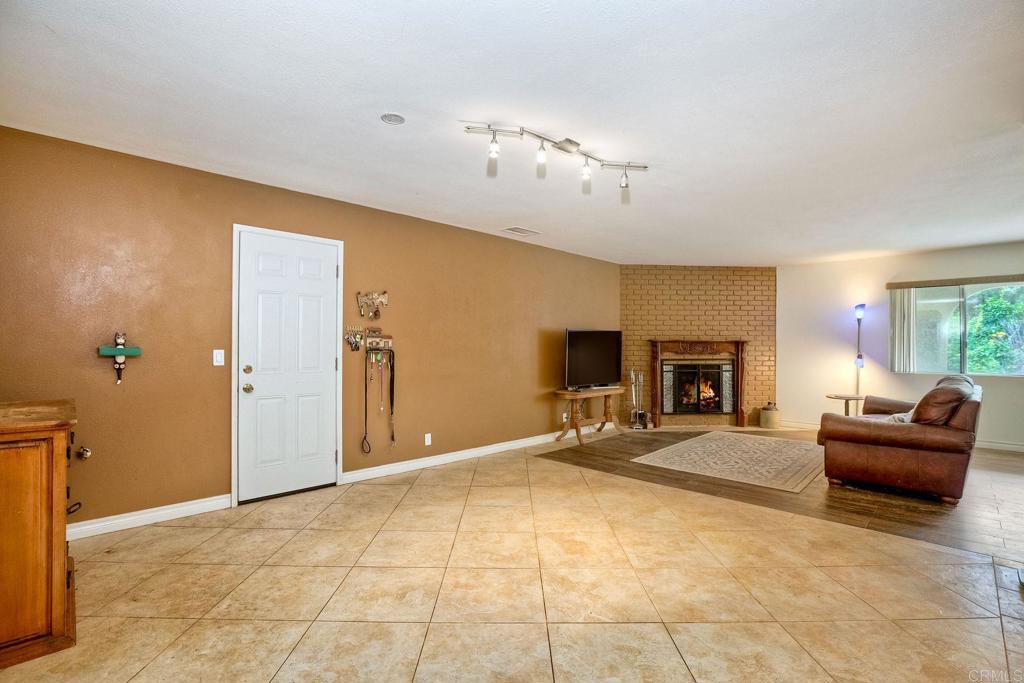 548 Taylor Street Vista, CA 92084 - Photo 19 of 74 a living room with furniture and a fireplace