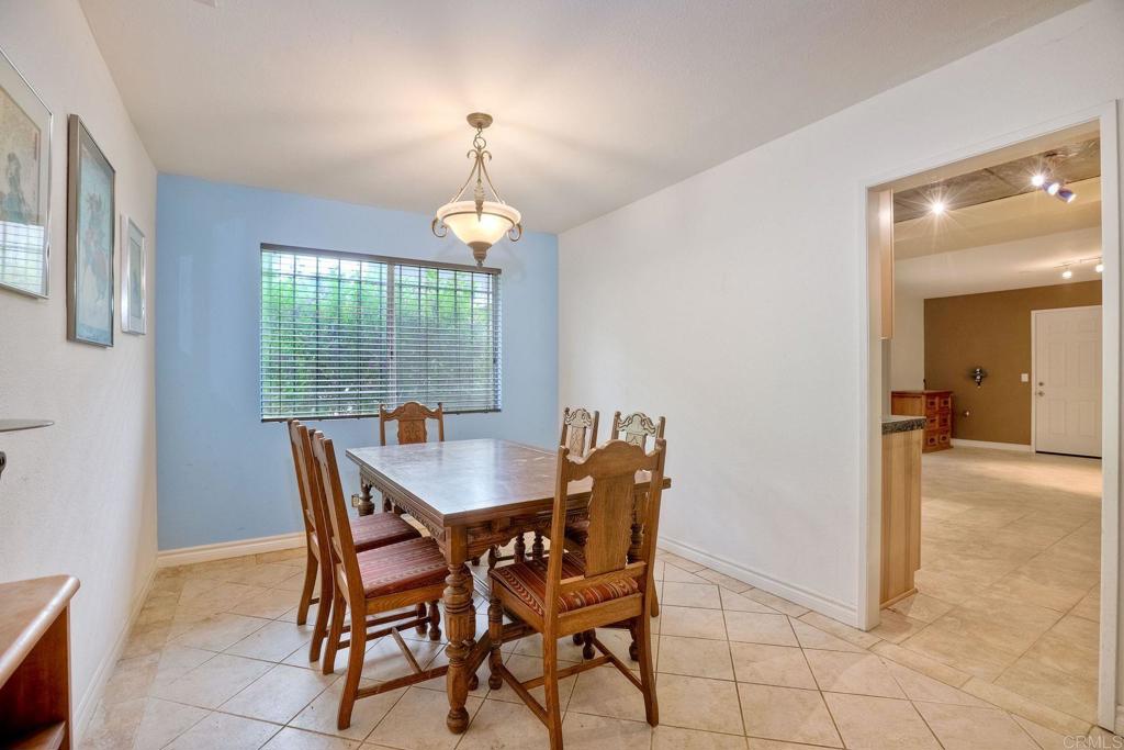 548 Taylor Street Vista, CA 92084 - Photo 25 of 74 a view of a dining room with furniture and chandelier