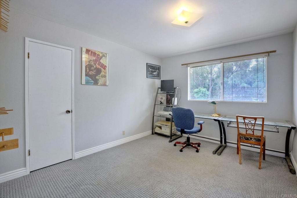 548 Taylor Street Vista, CA 92084 - Photo 28 of 74 a view of a workspace with furniture and a window