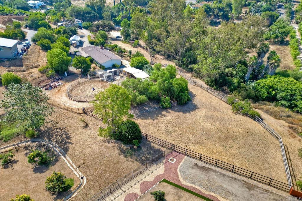 548 Taylor Street Vista, CA 92084 - Photo 5 of 74 an aerial view of a house with a yard and greenery
