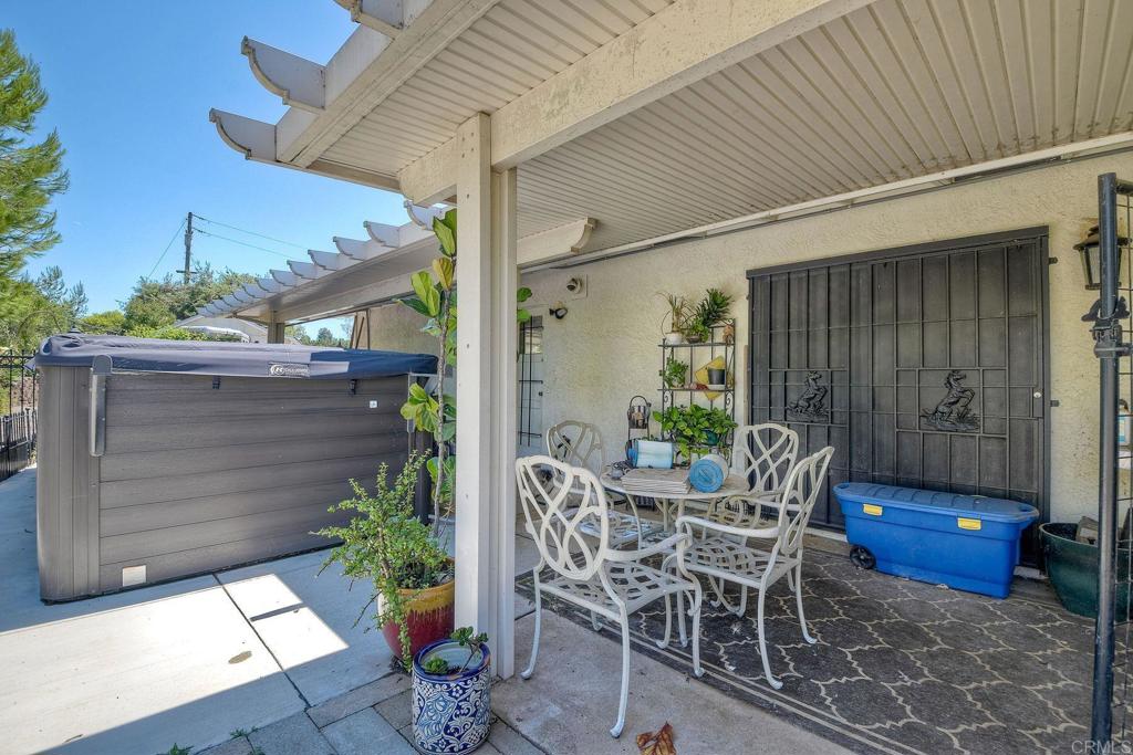 548 Taylor Street Vista, CA 92084 - Photo 62 of 74 a view of a patio with table and chairs potted plants