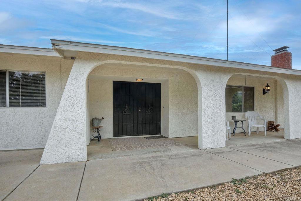 548 Taylor Street Vista, CA 92084 - Photo 10 of 74 a view of a hallway with wooden floor and a fireplace