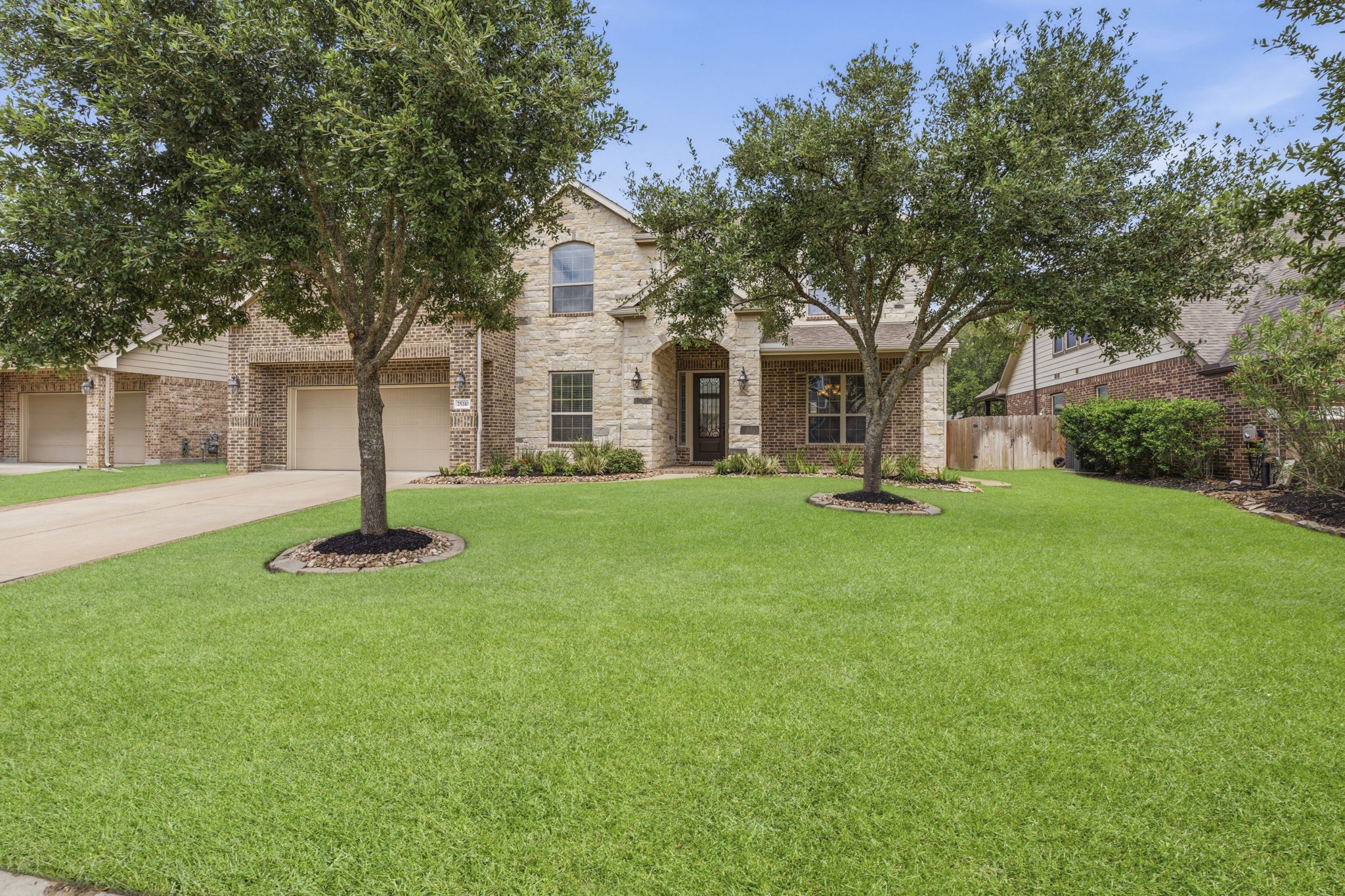 25210 Gaddis Oaks Drive Spring, TX 77389 - Photo 47 of 50 a front view of a house with a yard