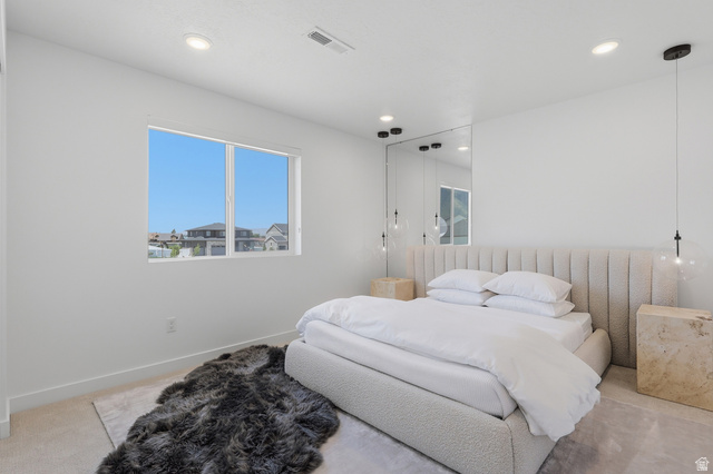 3364 Mapleton Hts Drive, Unit 101 Mapleton, UT 84664 - Photo 29 of 37 Bright room featuring a large window, recessed lighting, and a mirrored accent wall