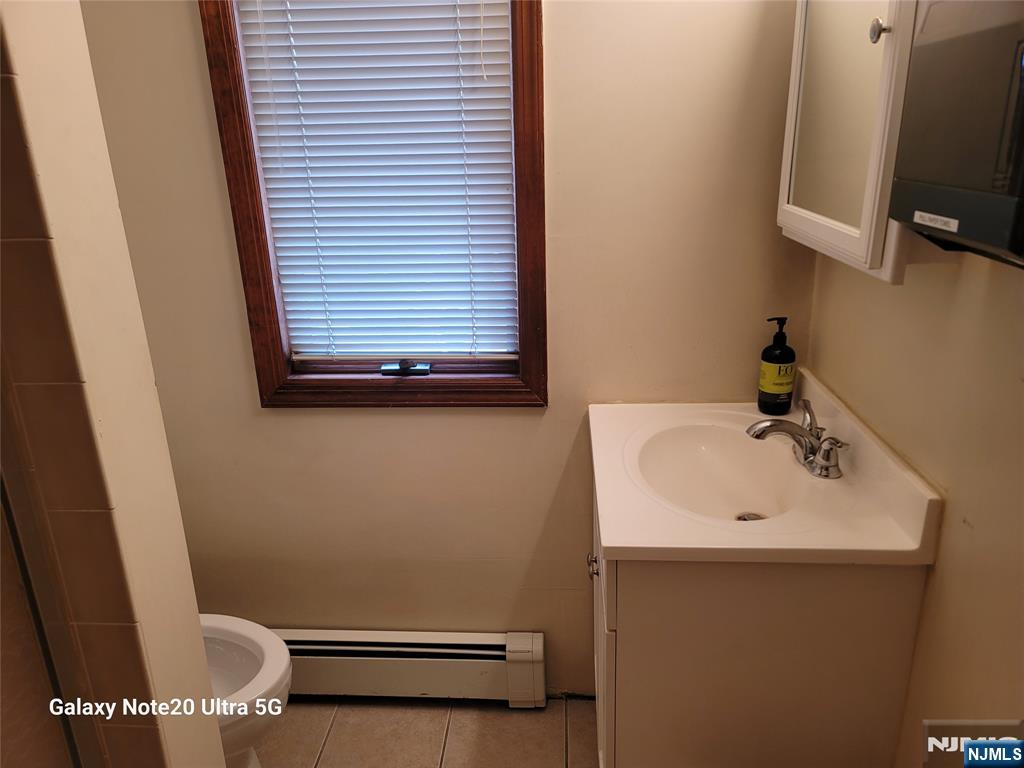 16 Jefferson Street Hackensack, NJ 07601 - Photo 11 of 29 a bathroom with a sink and a toilet