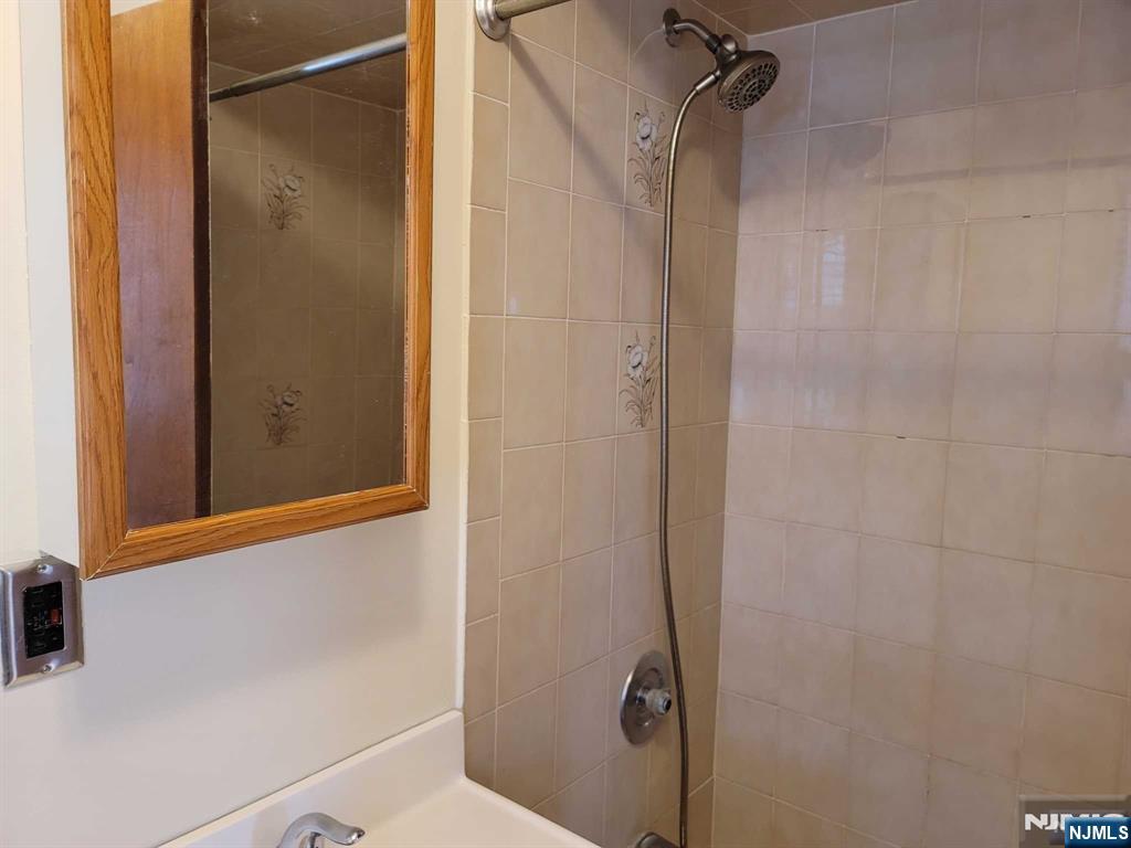 16 Jefferson Street Hackensack, NJ 07601 - Photo 27 of 29 a bathroom with a shower and a toilet