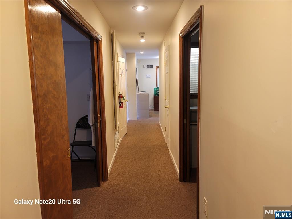 16 Jefferson Street Hackensack, NJ 07601 - Photo 10 of 29 a view of a hallway with wooden floor