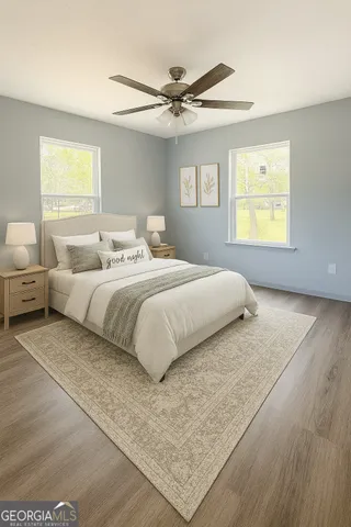 a bedroom with a bed and window