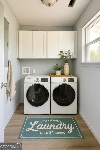 a view of a kitchen with a sink and cabinets