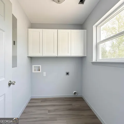 a view of room with window and hardwood floor