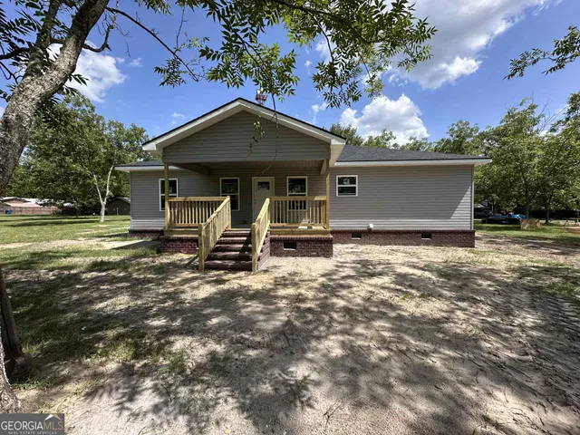 front view of a house with a yard